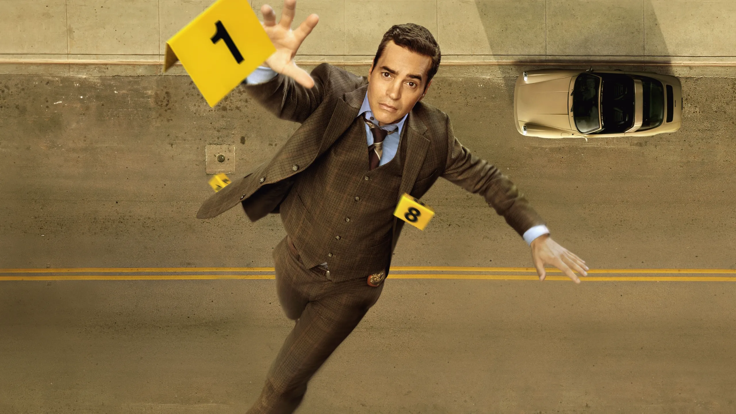 Will Trent (Ramón Rodríguez) falling while reaching for a yellow evidence marker.