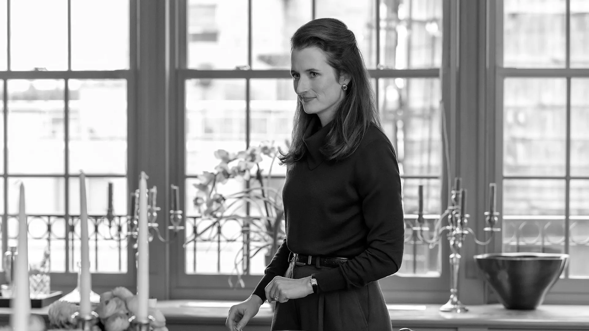 Candid shot of Caroline Kennedy (Mamie Gummer) in a black and white set photo from FX's Love Story.
