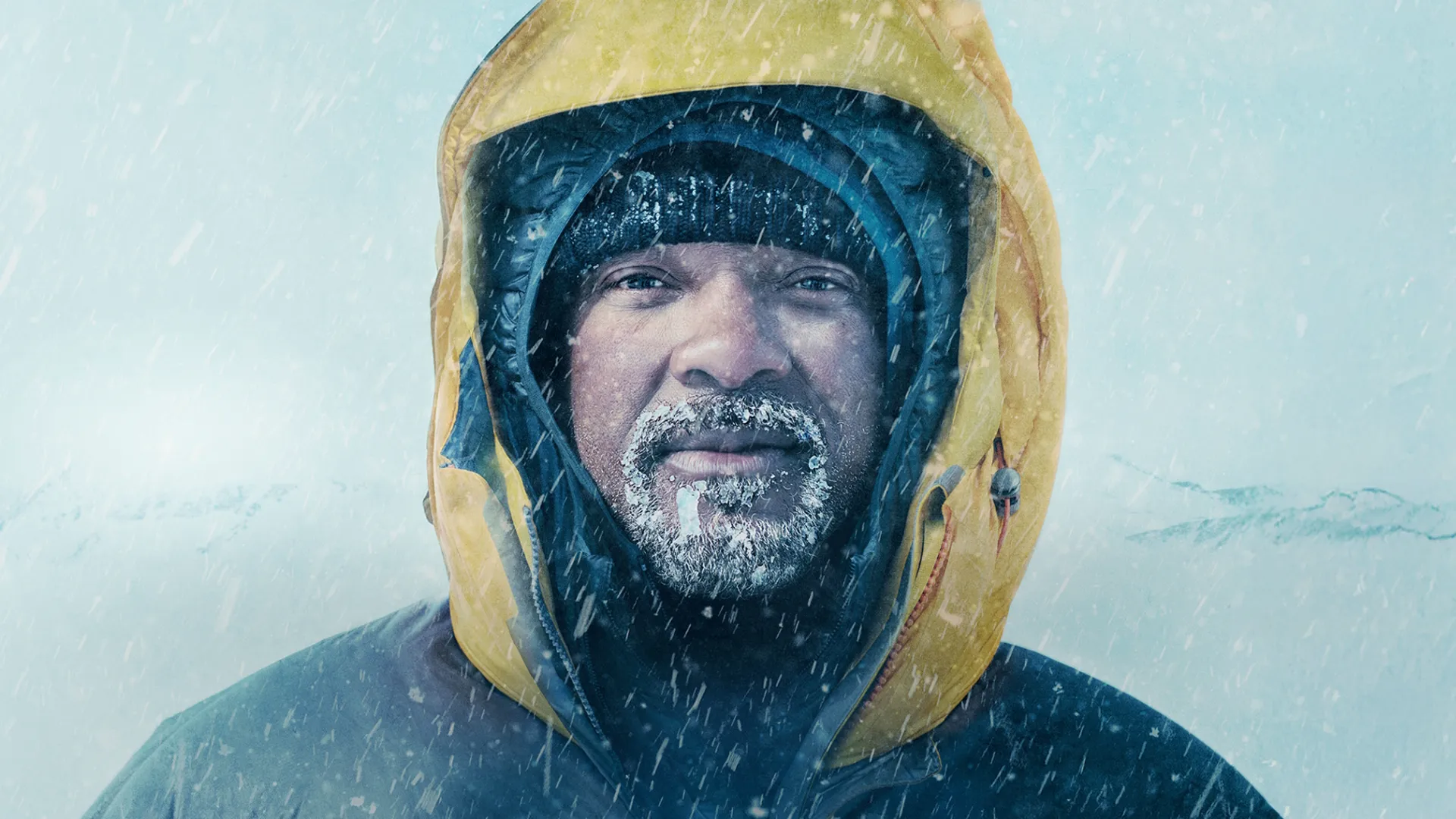 Will Smith wearing a heavy yellow winter jacket is caught in a snowstorm in promotional art for Pole to Pole with Will Smith.