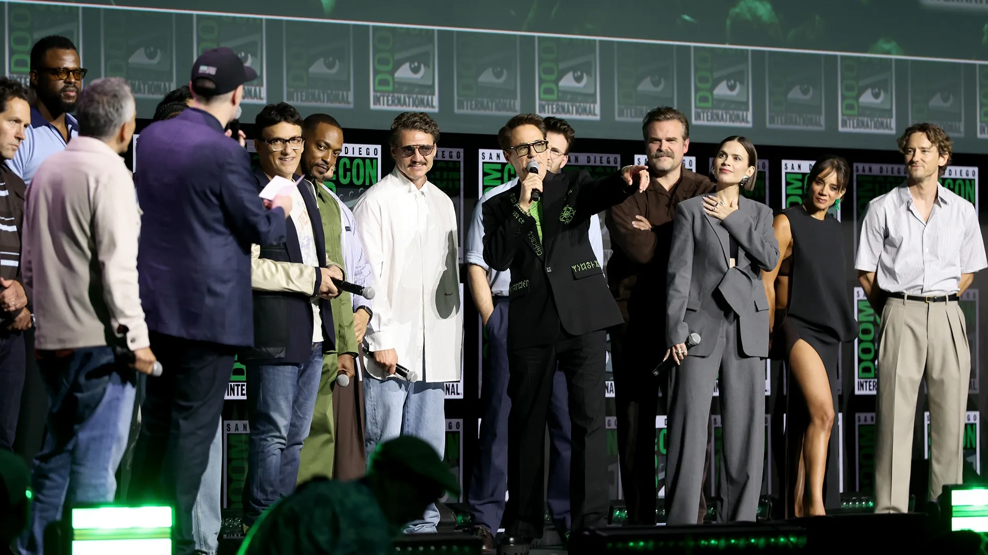 SAN DIEGO, CALIFORNIA - JULY 25: (L-R) Paul Rudd, Winston Duke, Joe Russo, Kevin Feige, President, Marvel Studios, Anthony Russo, Anthony Mackie, Pedro Pascal, Robert Downey Jr., Chris Evans, David Harbour, Hayley Atwell, Hannah John-Kamen and Lewis Pullman speak onstage during the Marvel Studios Panel at 2026 San Diego Comic-Con on July 25, 2026 in San Diego, California.