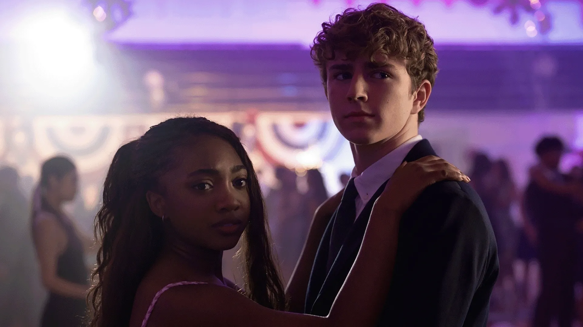  Percy Jackson (Walker Scobell) and Annabeth Chase (Leah Sava Jeffries) sharing a dance scene at Westover Hall in an official first-look preview for season three of Percy Jackson and the Olympians