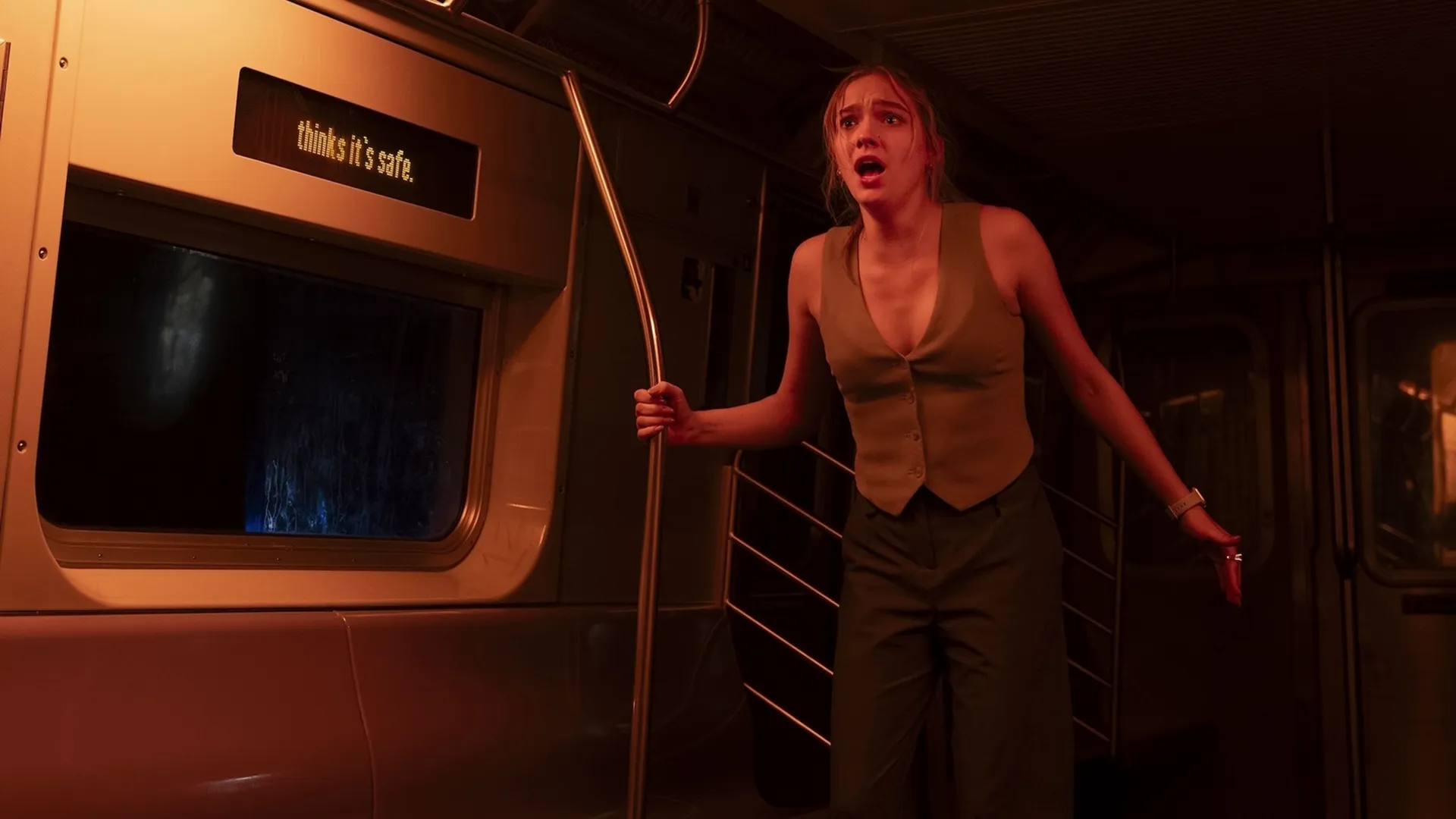 Cece stands rigid in terrifying shock while on a train in Goosebumps: The Vanishing.