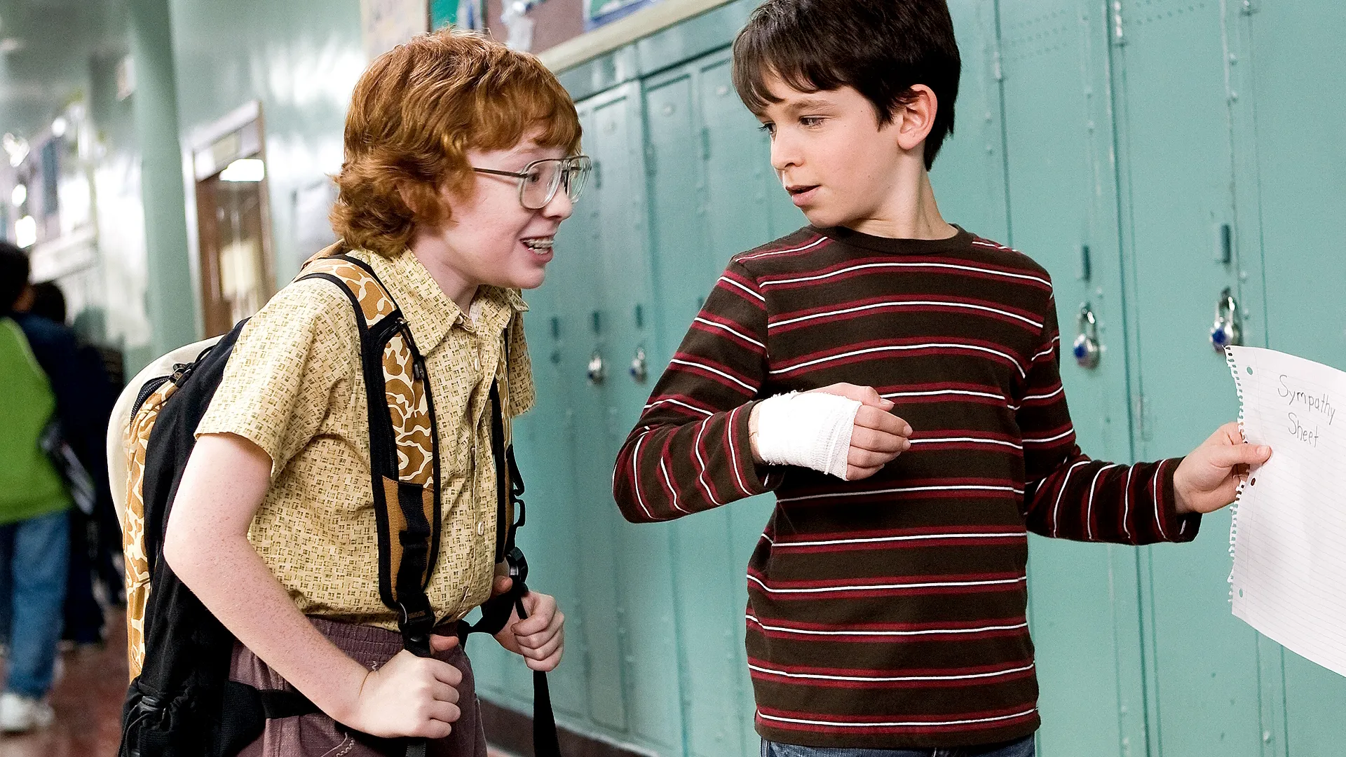 Greg Heffley (Zachary Gordon) attempts to get people to sign a Sympathy Sheet at school after he injured his hand.