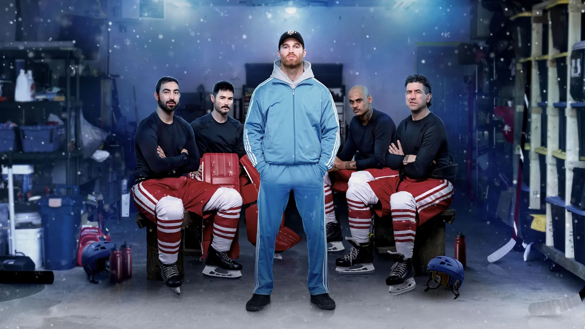 Shoresy (Jared Keeso) stands in a garage in front of his hockey teammates