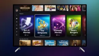 Disney+ home screen on a TV showing a Playlists row with Sci-Fi Movies, The Simpsons, Comedy Movies and Bob’s Burgers playlist tiles.