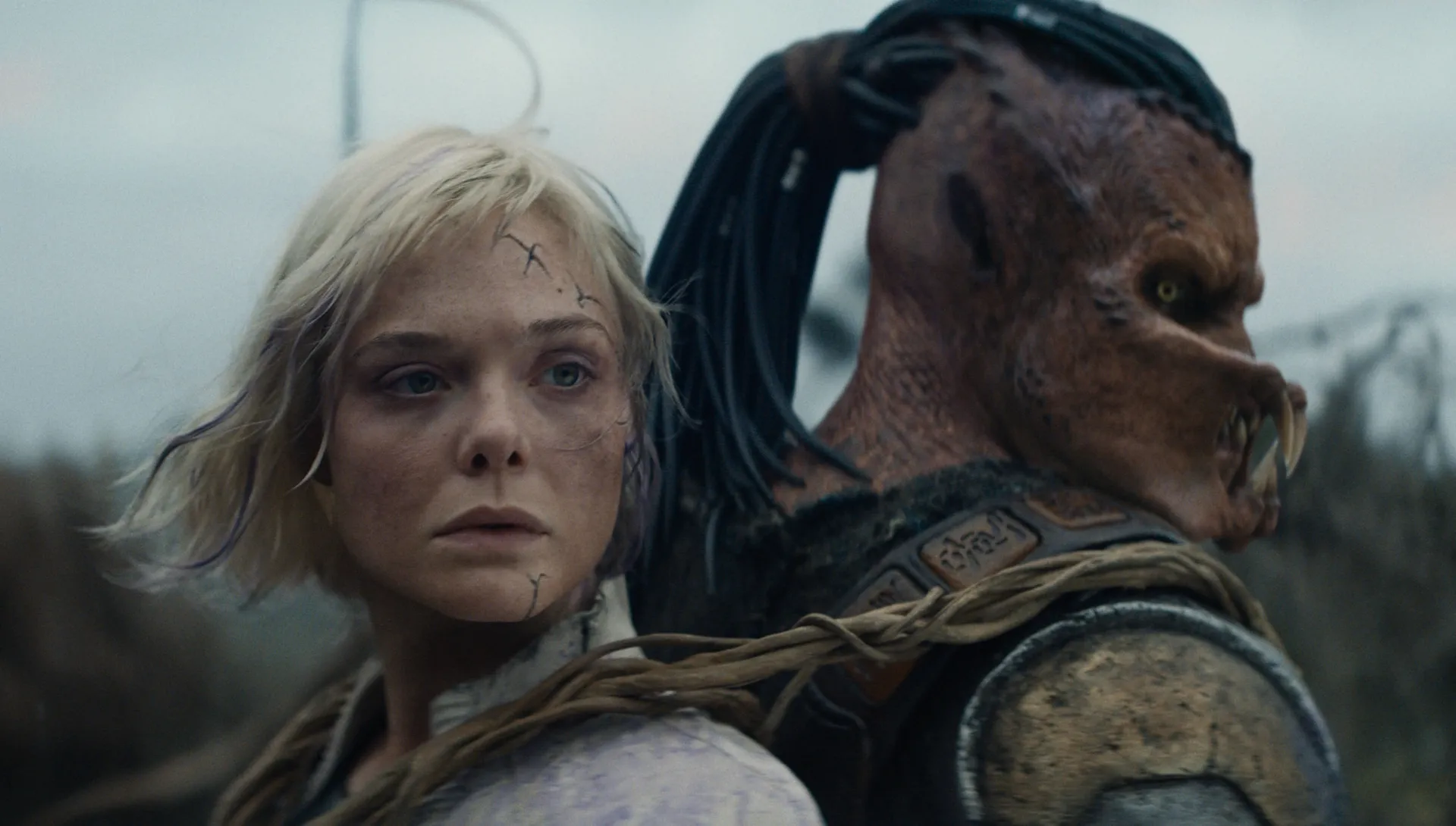 Thia (Elle Fanning) and Dek the Yautja (Dimitrius Schuster-Koloamatangi) in Predator: Badlands