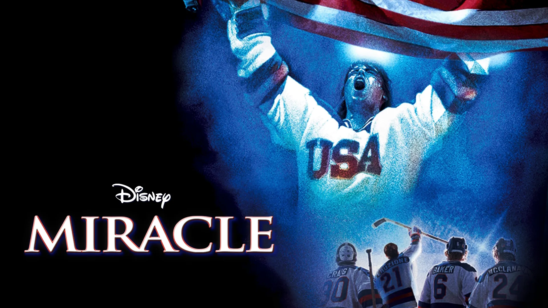 An ice hockey player in a USA jersey holds his hands up in celebration