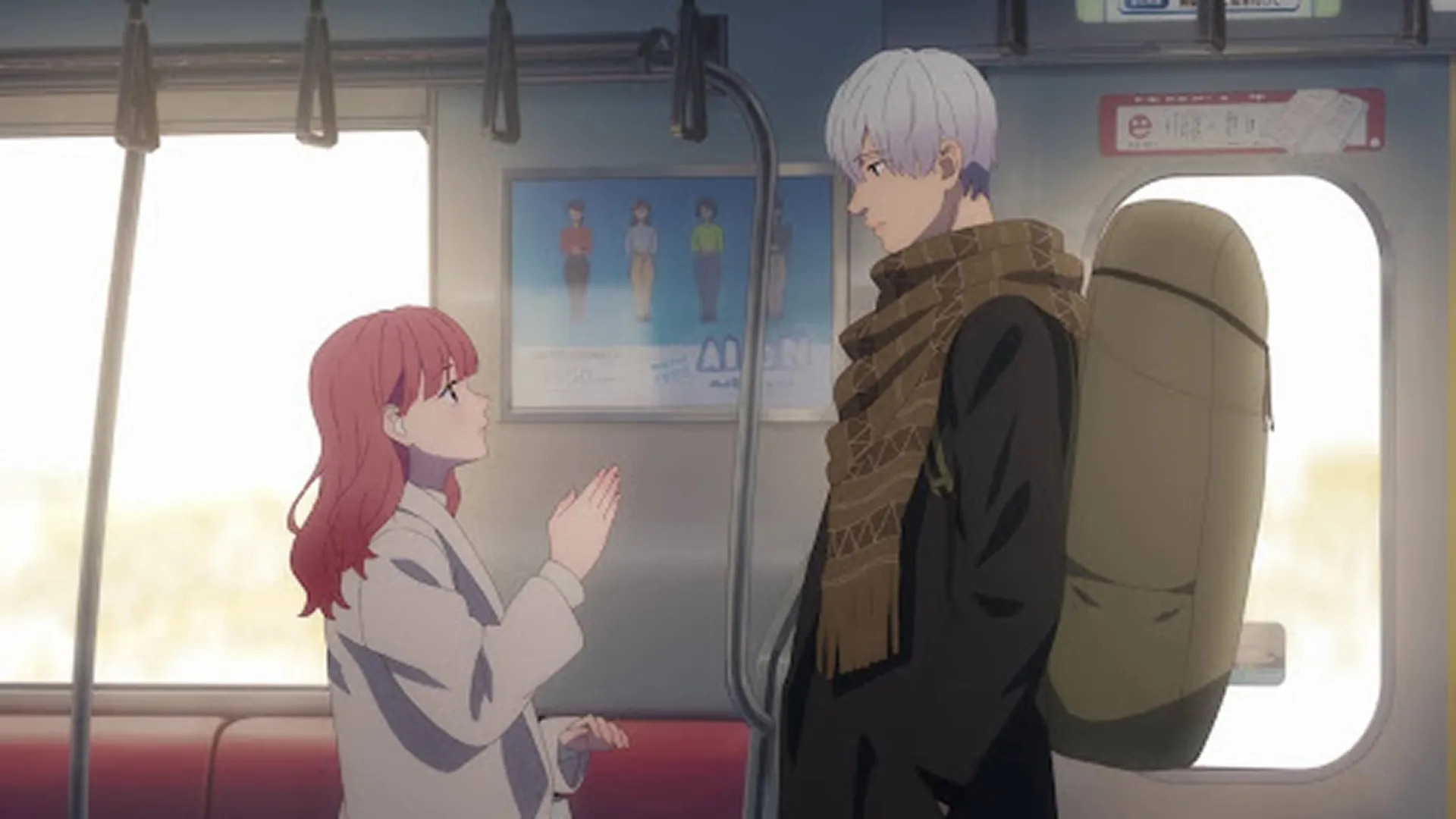 An official anime scene from A Sign of Affection, featuring the pink-haired Yuki Itose using sign language to communicate with the silver-haired Itsuomi Nagi while standing inside a moving commuter train car.