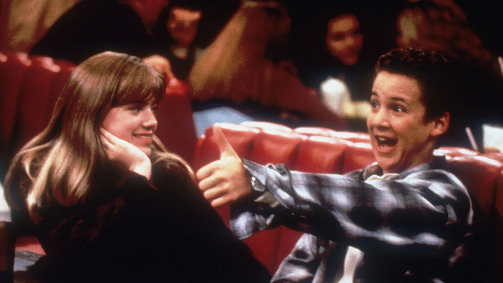 Cory (Ben Savage) in a diner with Topanga (Danielle Fishel).
