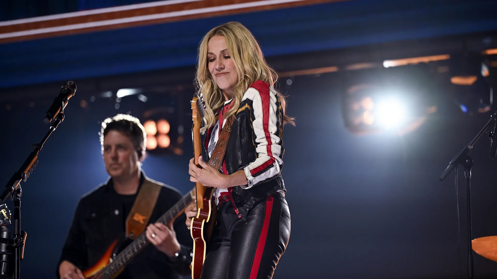 Sheryl Crow playing guitar on stage at D23: The Ultimate Disney Fan Event 2026