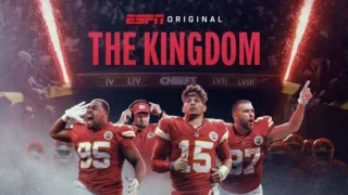 Chris Jones, head coach Andy Reid, Patrick Mahomes, and Travis Kelce running out of the tunnel in front of a crowd.