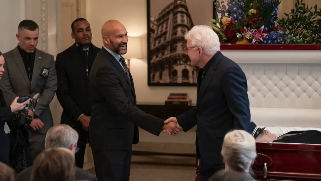 Keegan-Michael Key smiles and shakes hands with Steve Martin