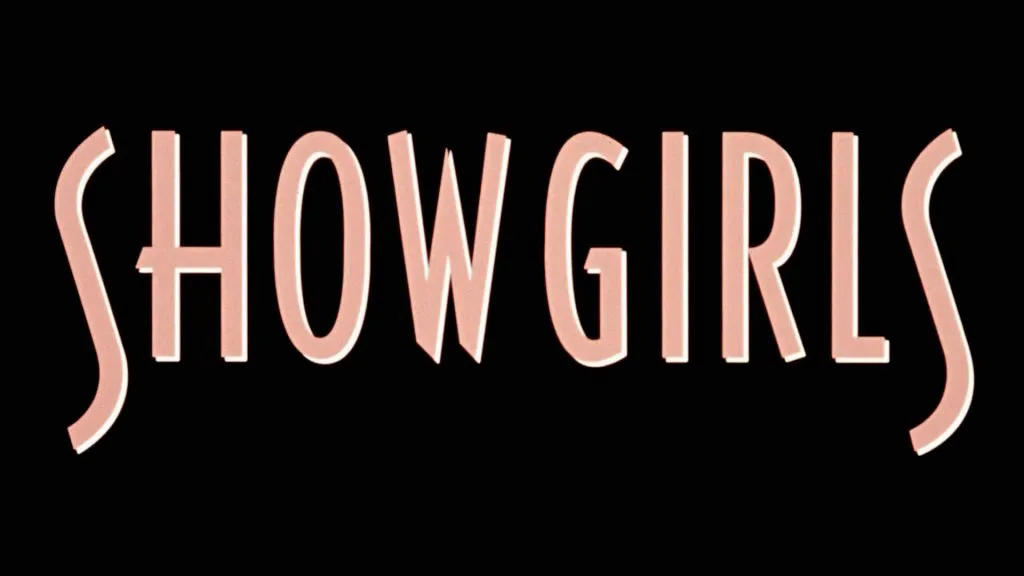 Title art for Showgirls featuring the film’s minimalist pink lettering on a black background.