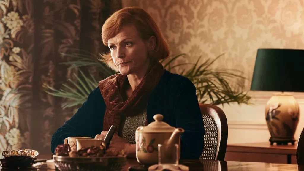 A still image of Maxine Peake as older Dolours Price in the series, Say Nothing.