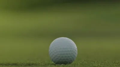 An image of a golf ball on a putting green.