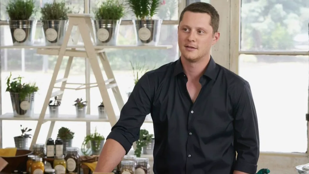 A still image of Noah Reid as Patrick Brewer in an episode of Schitt’s Creek.