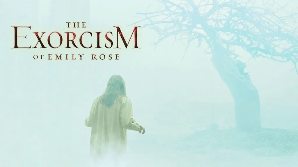 Poster for The Exorcism of Emily Rose showing a woman in a nightgown standing in a foggy field near a twisted, leafless tree, with the movie title in red text above her.