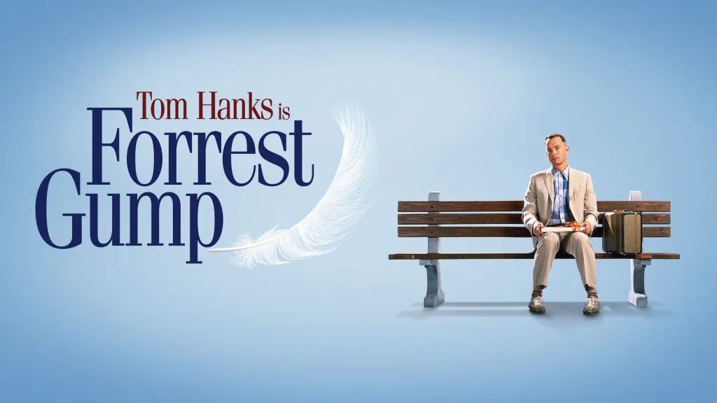 Official title art for the film Forrest Gump showing Tom Hanks sitting on a park bench holding a box of chocolates.