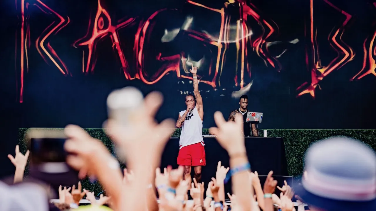 Tyla Yaweh performs onstage during Austin City Limits Music Festival as fans cheer from the crowd.