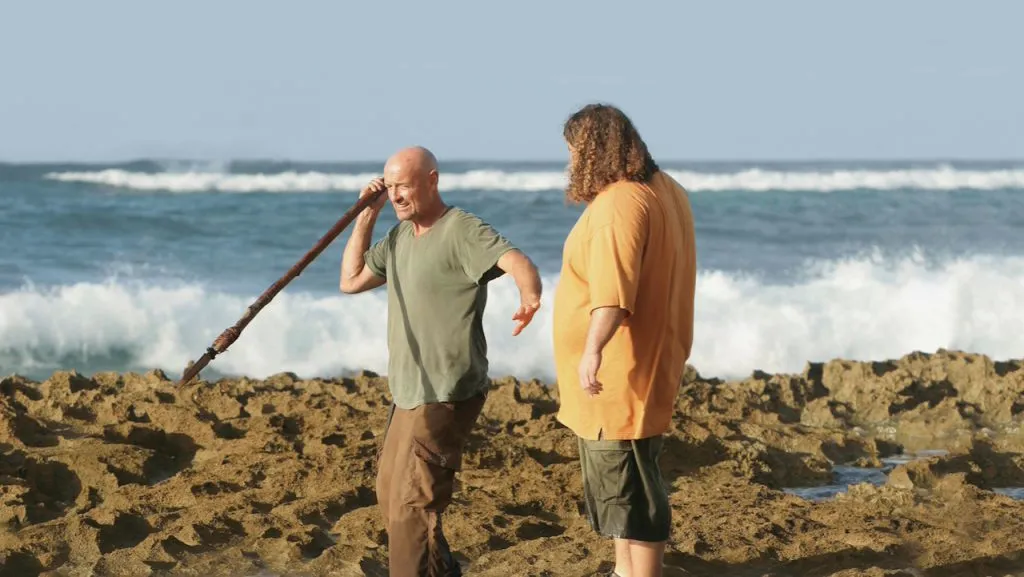 A still image of Jorge Garcia as Hugo Reyes and Terry O’Quinn as John Locke in the TV show, Lost.