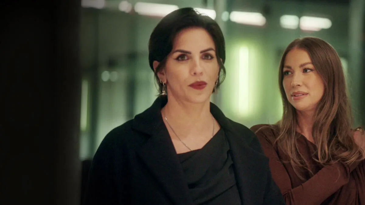 Katie Maloney and Stassi Schroeder sitting next to each other in a still image from an episode of House of Stassi.