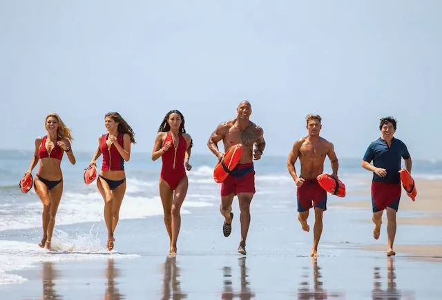 Still from the Baywatch remake with The Rock and Zac Effron