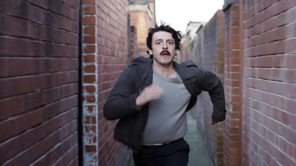 A still image of Anthony Boyle as Brendan Hughes in the series, Say Nothing.