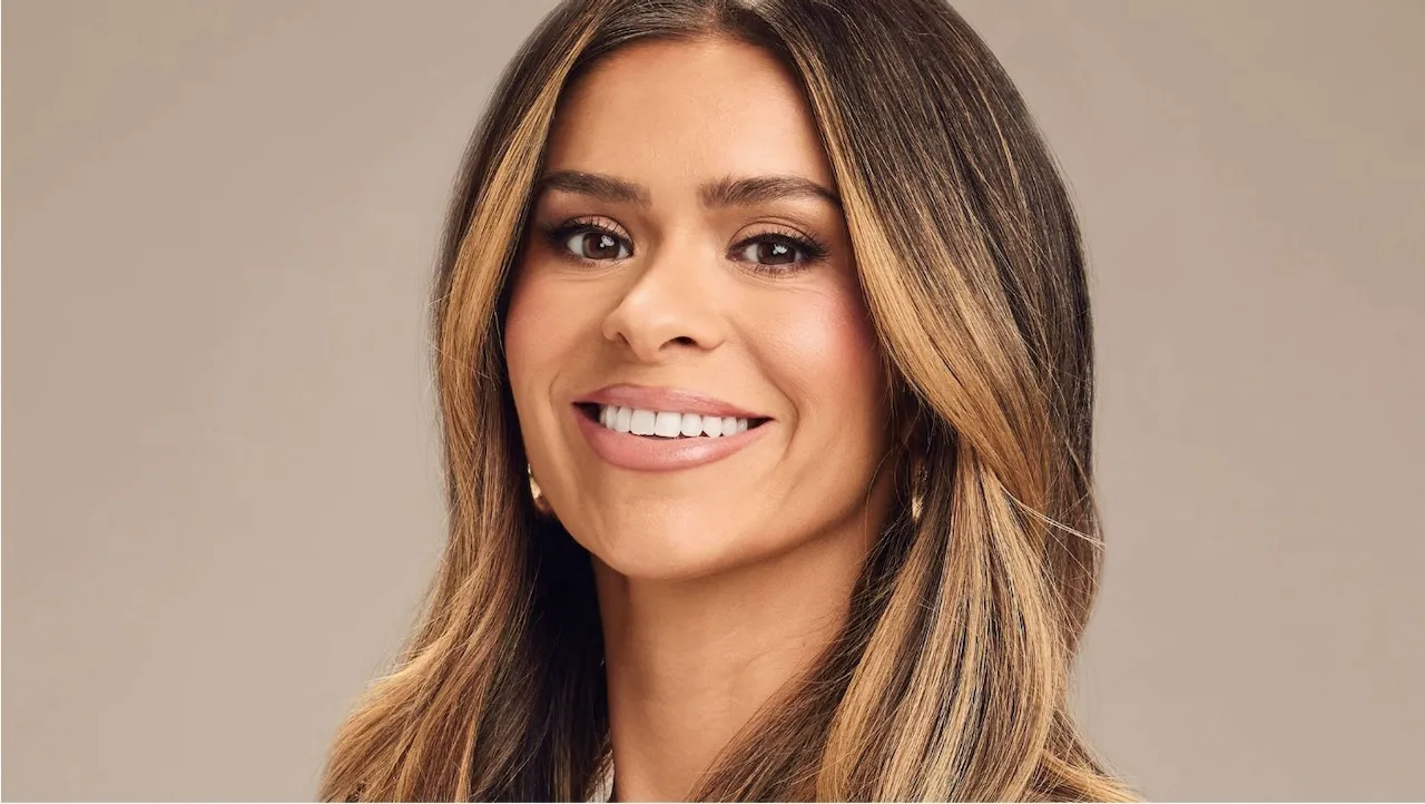 A headshot of Taylor Frankie Paul in front of a tan backdrop.