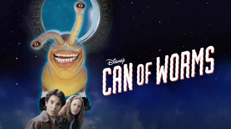 Title art for Disney’s Can of Worms featuring a large alien with eyestalks grinning above two startled teens under a moonlit sky.