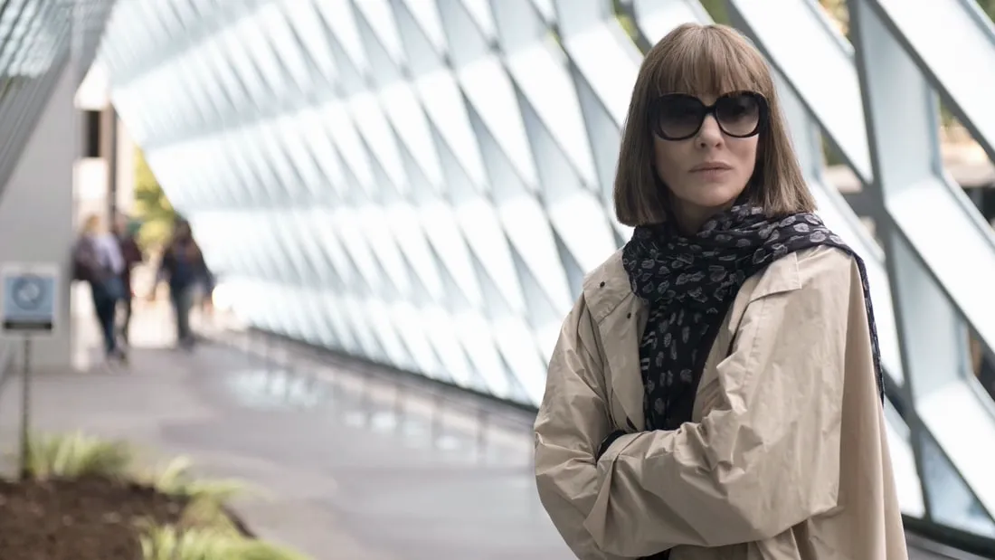 Cate Blanchett posing in a trench coat and sunglasses in Where’d You Go Bernadette.