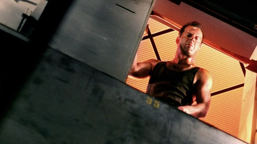 A still image of Bruce Willis from Die Hard, considered one of the best ’80s movies.