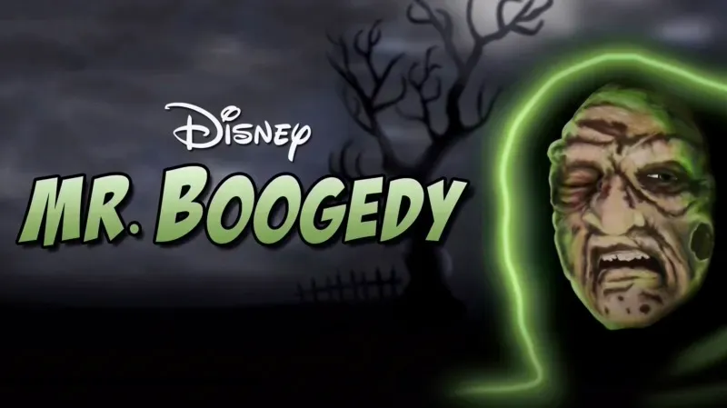 Title art for Disney’s Mr. Boogedy featuring the ghostly face of Mr. Boogedy glowing green against a dark, eerie background with barren trees.