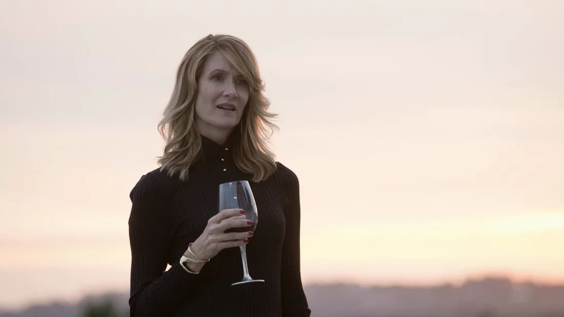 Laura Dern holing a wine glass starring in Big Little Lies